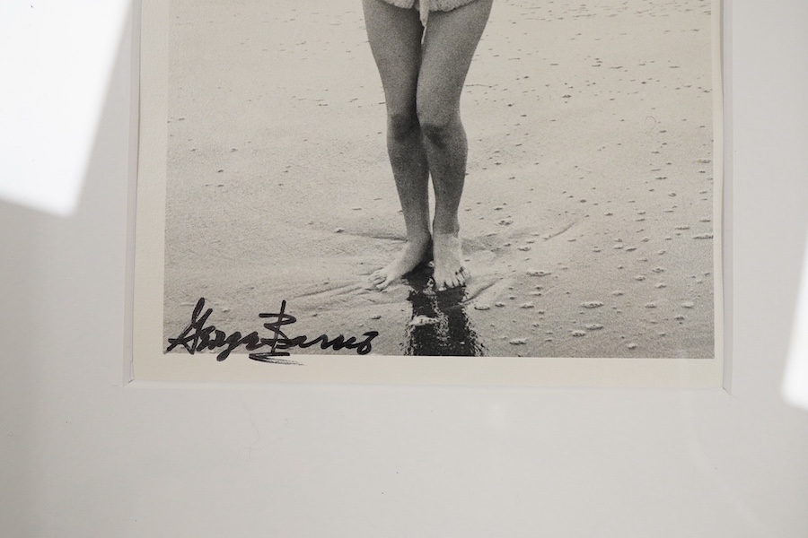 George Barris, a black and white photograph of Marilyn Monroe on a beach, signed in black ink by Barris to the lower edge of the image, stamped to the reverse; ‘ 1987 George Barris/Marilyn Monroe Weston Editions Ltd. All
